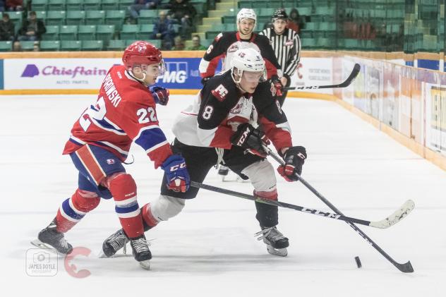 Prince George Cougars left wing Jackson Leppard (right) against the Spokane Chiefs