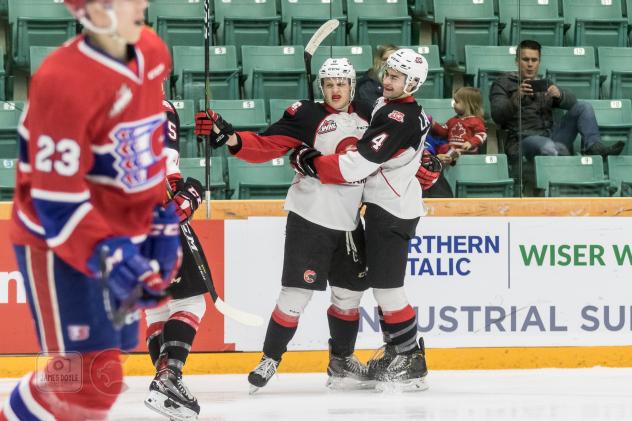 Prince George Cougars celebrate a goal against the Spokane Chiefs