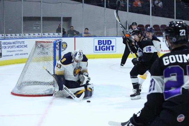 Norfolk Admirals goaltender Ty Reichenbach stops a shot against the onrushing Reading Royals