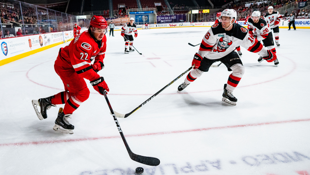 Binghamton Devils defenseman Desmond Bergin (right) against the Charlotte Checkers