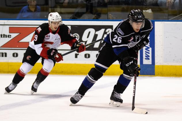 Prince George Cougars left wing Tyson Upper chases the Victoria Royals
