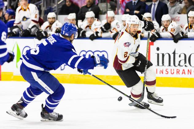Cleveland Monsters defenseman Adam Clendening (right) against the Toronto Marlies