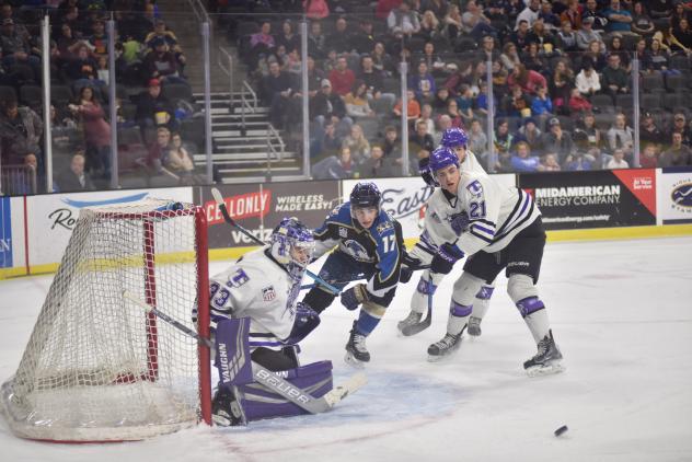 Sioux Falls Stampede right wing Ryan Sullivan (center) against the Tri-City Storm