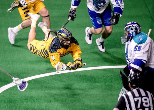 Lyle Thompson of the Georgia Swarm dives for a shot attempt against the Rochester Knighthawks