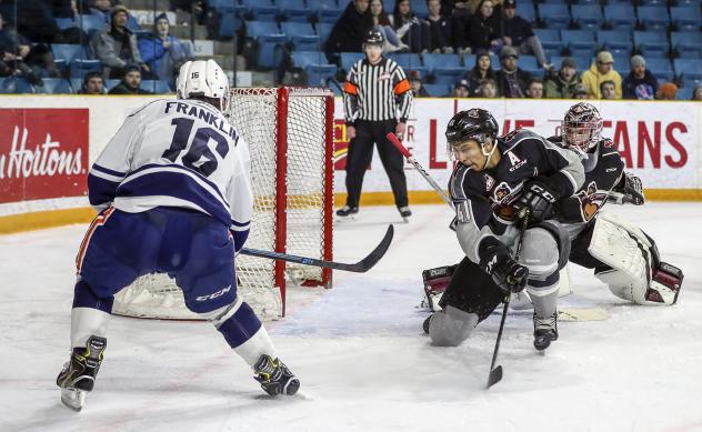 Vancouver Giants defenceman Alex Kannok Leipert (center) against the Kamloops Blazers