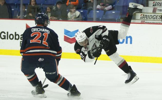 Vancouver Giants centre Justin Sourdif goes airborne against the Kamloops Blazers
