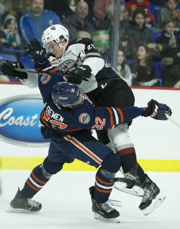 Vancouver Giants defenceman Kaleb Bulich delivers a hit against the Kamloops Blazers