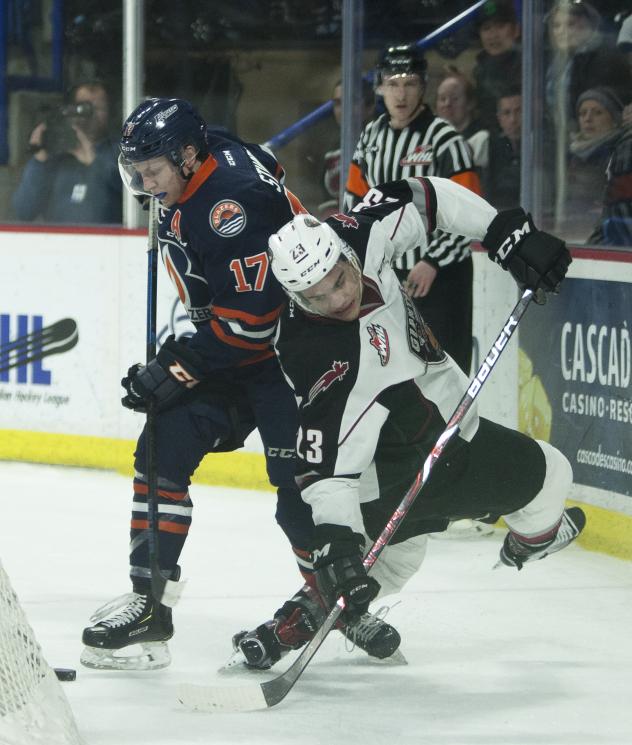 Vancouver Giants center Jadon Joseph (right) fights for the puck against the Kamloops Blazers