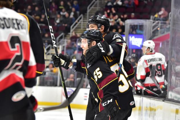 Cleveland Monsters defenseman Tommy Cross and center Mark Letestu (55) celebrate a goal