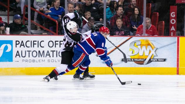 Vancouver Giants right wing Lukas Svejkovsky tries to get by the Spokane Chiefs
