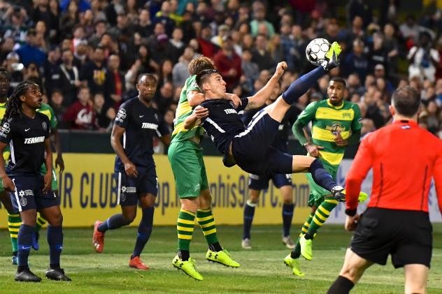 Memphis 901 FC goes airborne for a ball vs. the Tampa Bay Rowdies