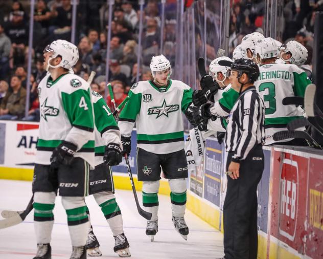 Texas Stars exchange congratulations along the bench