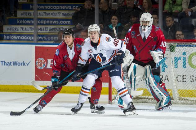 Kelowna Rockets in their Don Cherry jerseys try to keep the Kamloops Blazers at bay