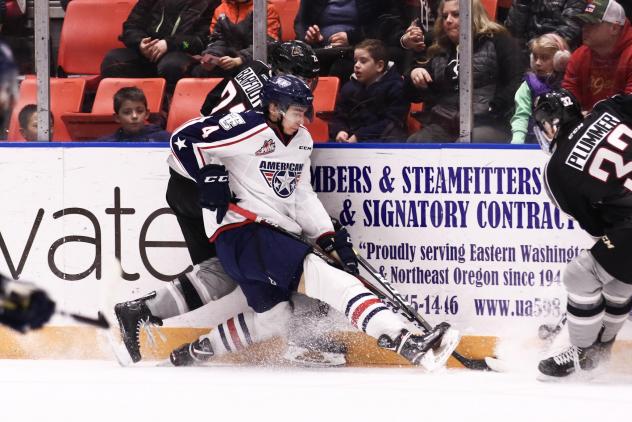 Vancouver Giants right wing Aidan Bargoot up against the boards vs. the Tri-City Americans