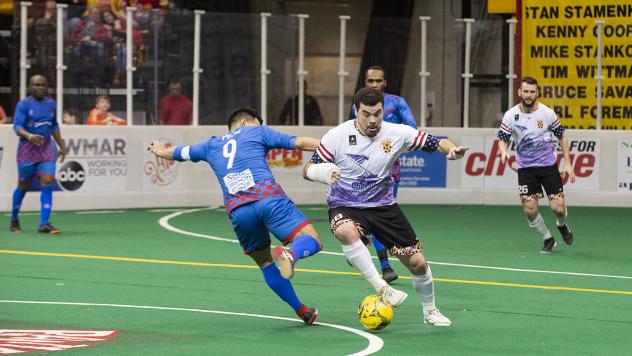 Vini Dantas of the Baltimore Blast with possession against the Kansas City Comets