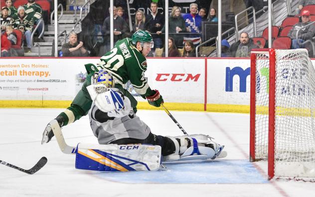 San Antonio Rampae goaltender Ville Husso makes a breakaway save on the Iowa Wild's Gerald Mayhew