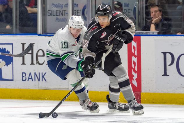 Justin Sourdif of the Vancouver Giants controls the puck against the Seattle Thunderbirds