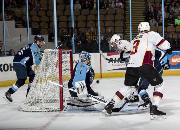 Cleveland Monsters press Milwaukee Admirals goaltender Troy Grosenick