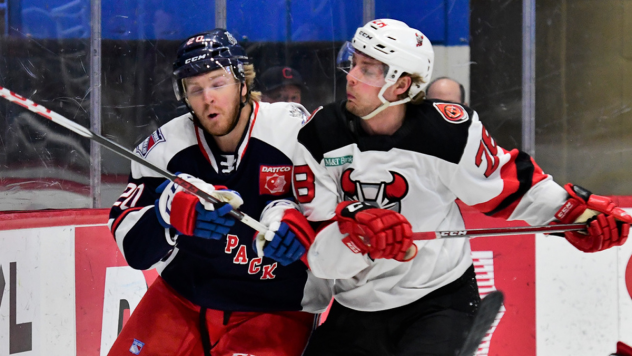 Binghamton Devils left wing Brandon Gignac (right) against the Hartford Wolf Pack