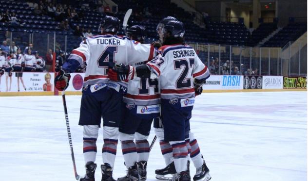 Evansville Thunderbolts trike a pose after a goal