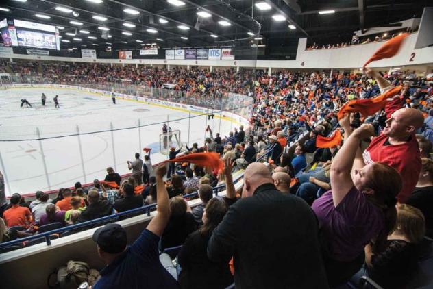 Flint Firebirds fans cheer on their team at the Dort Federal Credit Union Event Center