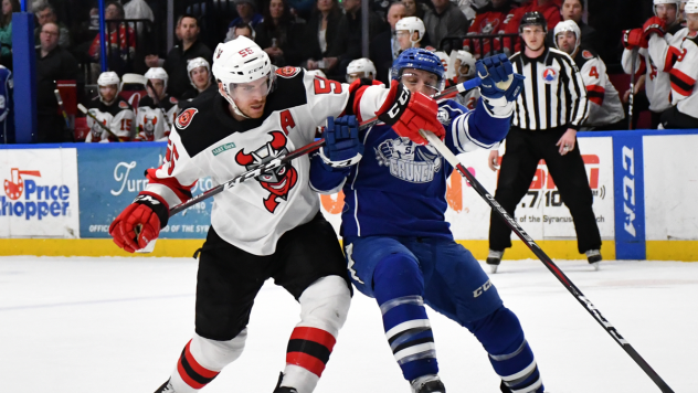 Binghamton Devils defenseman John Ramage delivers a blow to the Syracuse Crunch