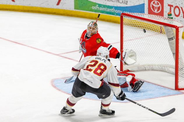 Zac Dalpe of the Cleveland Monsters scores against the Rockford IceHogs