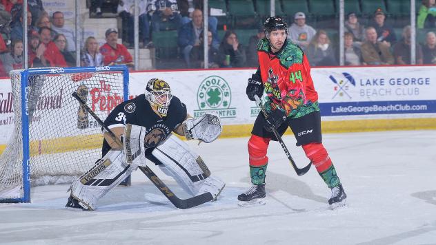 Conor Riley of the Adirondack Thunder sets up in front of the Newfoundland Growlers goal