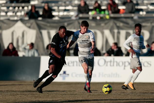 Sacramento Republic FC midfielder Drew Skundrich (right) with possession against the Colorado Springs Switchbacks