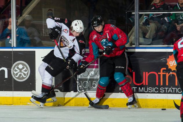 Vancouver Giants left wing Owen Hardy (left) battles the Kelowna Rockets