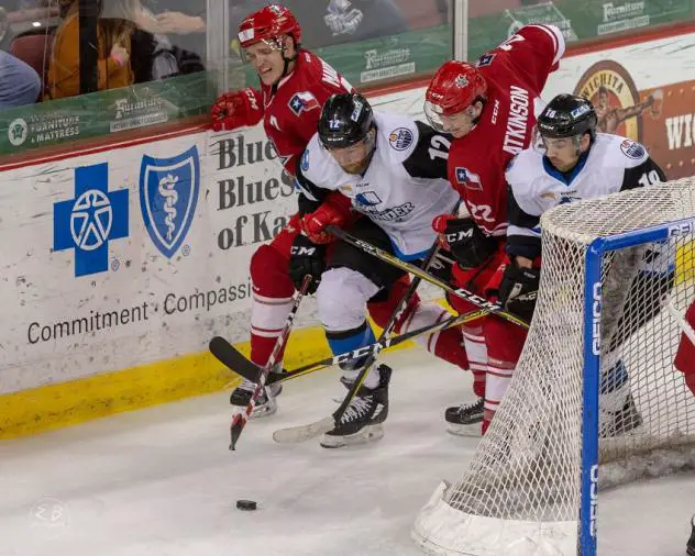 David Makowski (back) and Josh Atkinson of the Allen Americans battle the Wichita Thunder