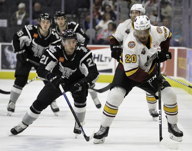 Joey LaLeggia of the San Antonio Rampage (left) chases down Chicago Wolves forward Keegan Kolesar