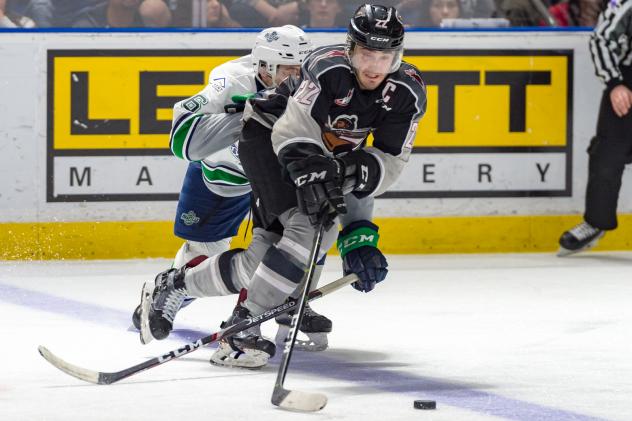 Vancouver Giants right wing Jared Dmytriw (right) vs. the Seattle Thunderbirds