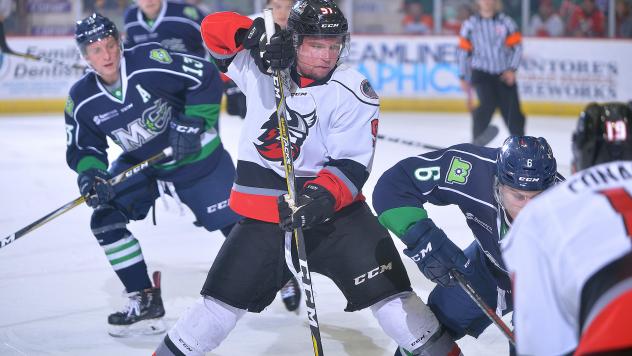 Mike Szmatula of the Adirondack Thunder battles the Maine Mariners