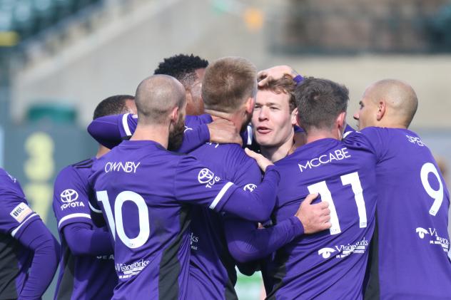 Louisville City players congratulate Magnus Rasmussen for his goal vs. Birmingham Legion FC Sunday at Louisville Slugger Field