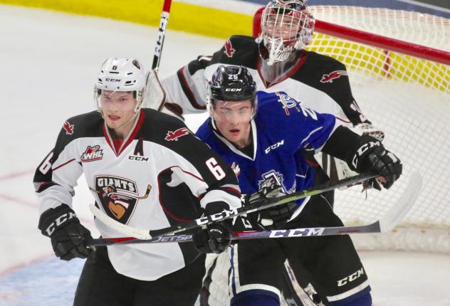 Vancouver Giants defenceman Dylan Plouffe (left) against the Victoria Royals