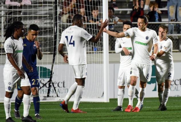 Memphis 901 FC forward Rashawn Dally (14) exchanges high fives with defender Marc Burch vs. North Carolina FC