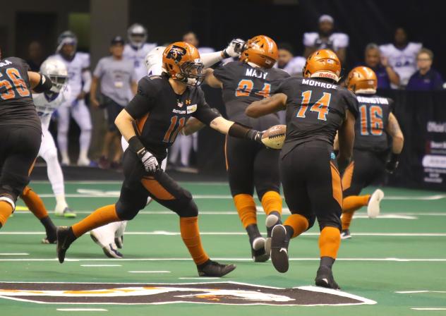 Darrell Monroe of the Arizona Rattlers receives a handoff against the San Diego Strike Force