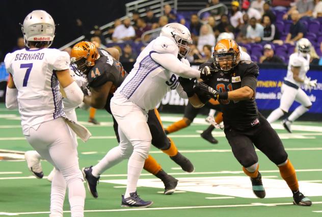 Chris McAllister of the Arizona Rattlers rushes from the edge against the San Diego Strike Force