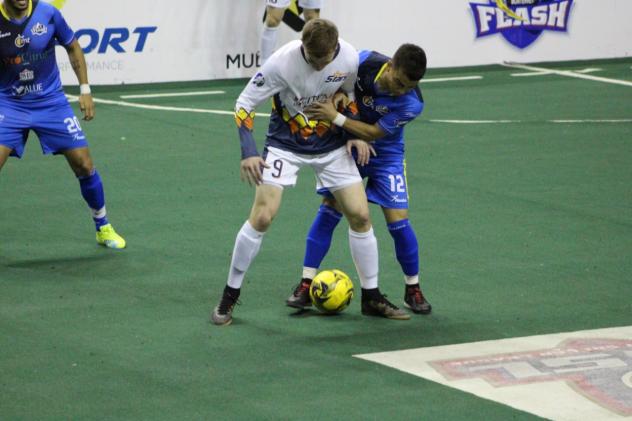 Tacoma Stars midfielder Derek Johnson (white) vs. the Monterrey Flash