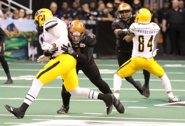 Arizona Rattlers with a tackle against the Tucson Sugar Skulls