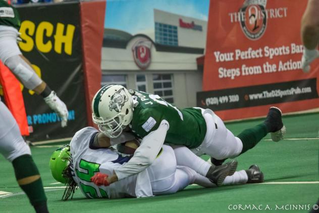 Green Bay Blizzard complete a tackle against the Nebraska Danger