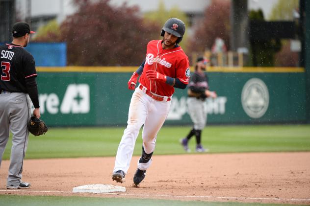 Tim Lopes of the Tacoma Rainiers rounds the bases