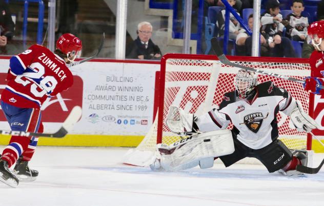 Vancouver Giants goaltender David Tendeck saves a shot by the Spokane Chiefs