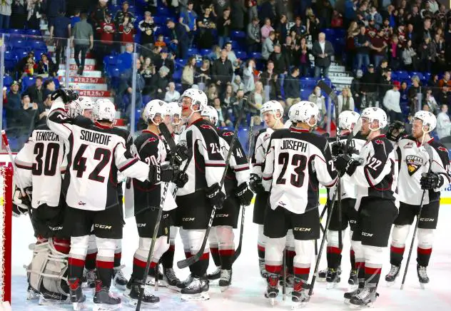 Vancouver Giants exchange congratulations following a win over the Spokane Chiefs
