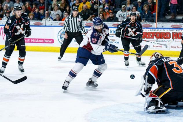 Tulsa Oilers forward Adam Pleskach takes a shot against the Kansas City Mavericks