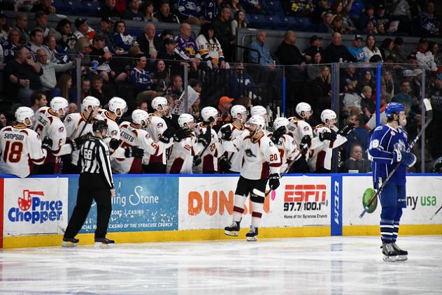 Cleveland Monsters center Justin Scott high fives the bench vs. the Syracuse Crunch