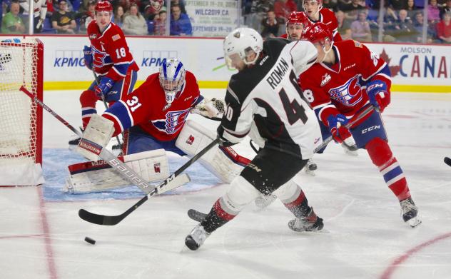 Vancouver Giants centre Milos Roman collects the puck against the Spokane Chiefs