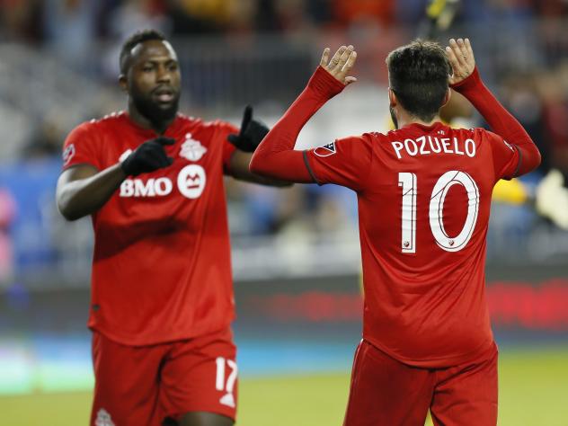 Toronto FC's Jozy Altidore (L) and Alejandro Pozuelo (R)