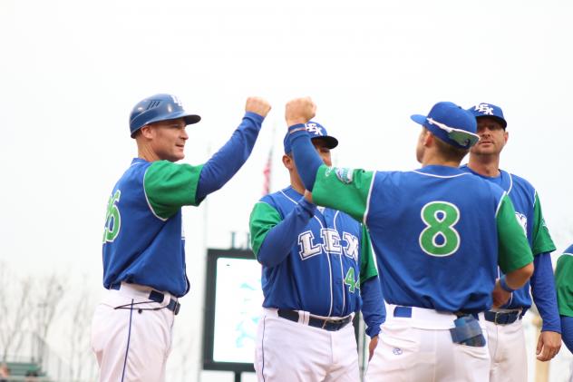 Lexington Legends manager Brooks Conrad delivers fist bumps